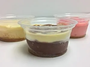 Cheesecake cups with a chocolate base, plain and strawberry